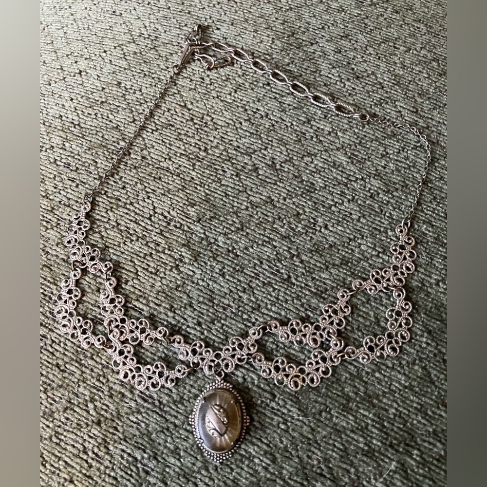 Vintage silver tone filigree necklace with camphor glass?pendant.